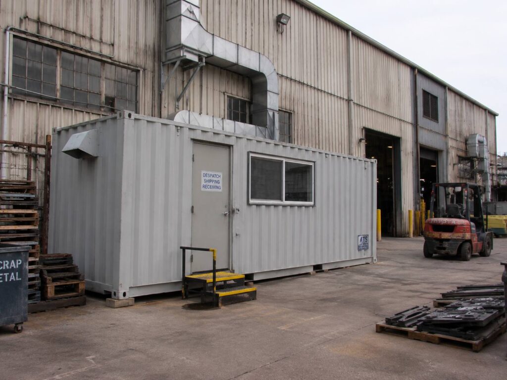 Shipping container converted into a despatch, shipping and receiving office at a facility